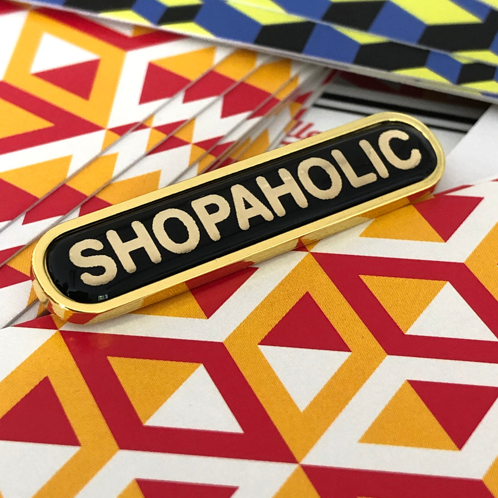 Removable shopaholic badge