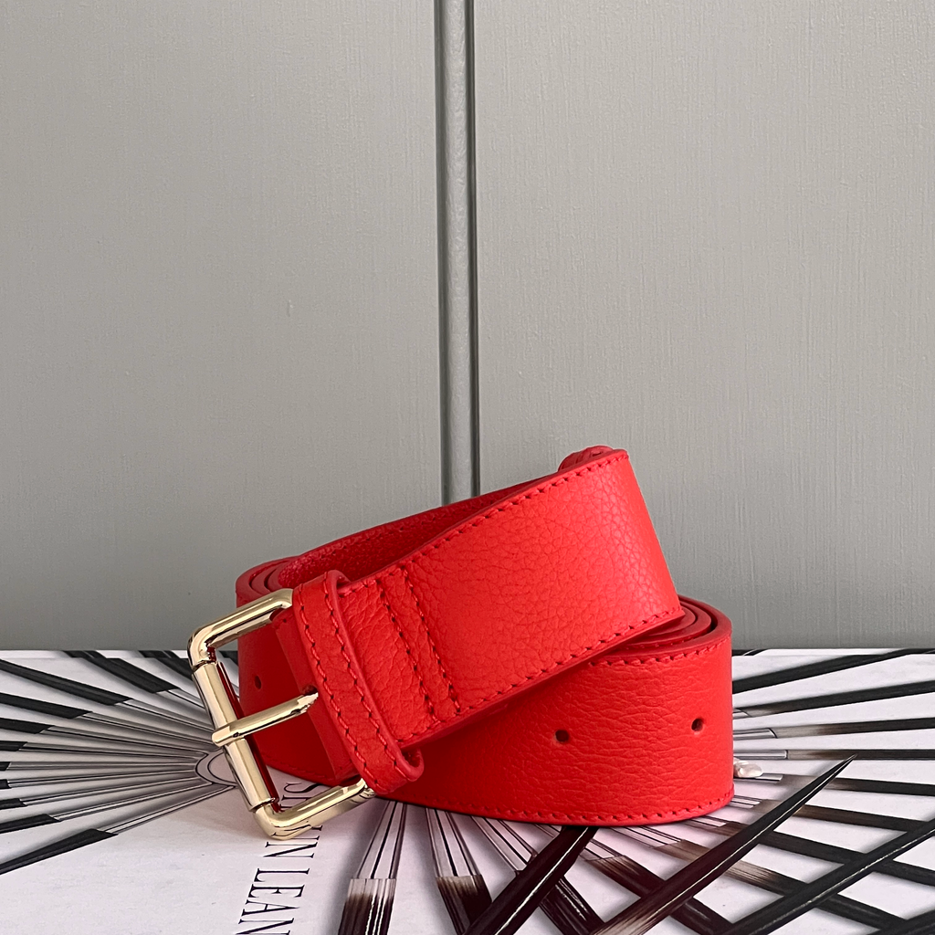 Red leather belt with gold buckle