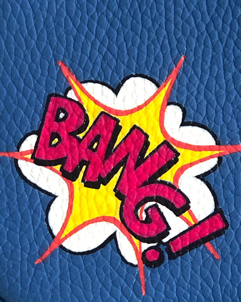 BANG graphic design on blue leather bag