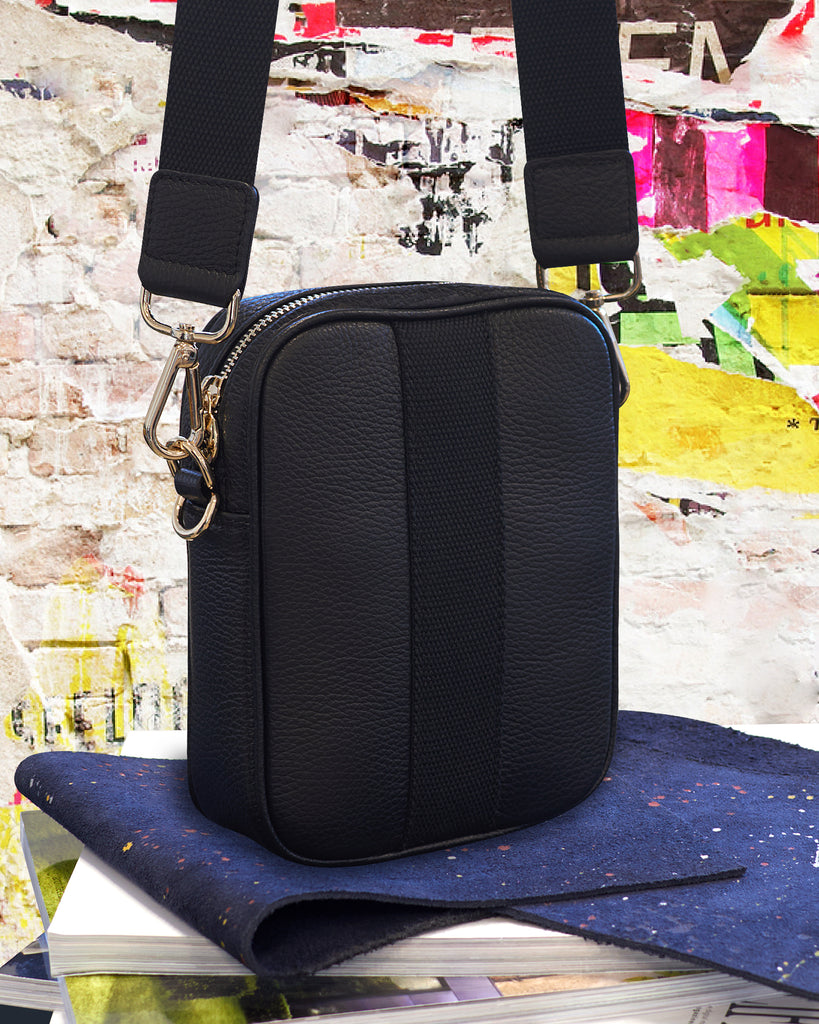 Black camera crossbody bag with gold hardware