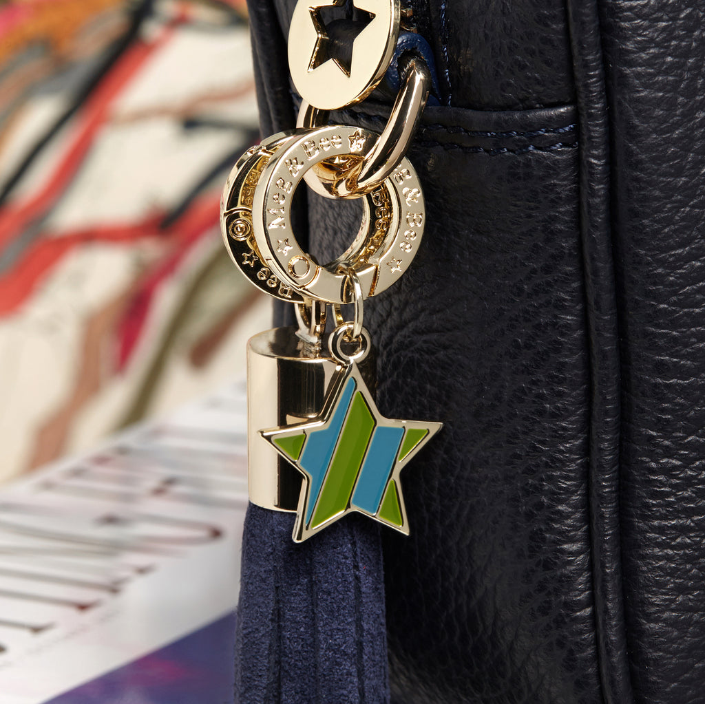 Green and blue striped star with gold hardware and attachable charm ring 