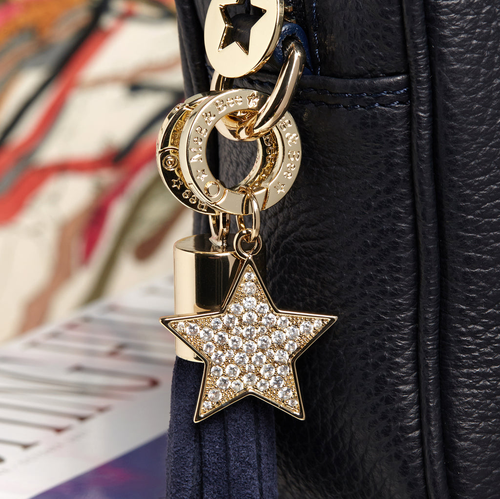 Star bag charm with diamanté.  Gold hardware and charm ring.