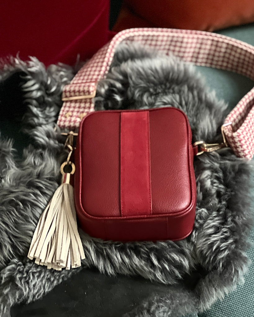 Cranberry red crossbody bag with ride tweed strap and cream large leather tassel
