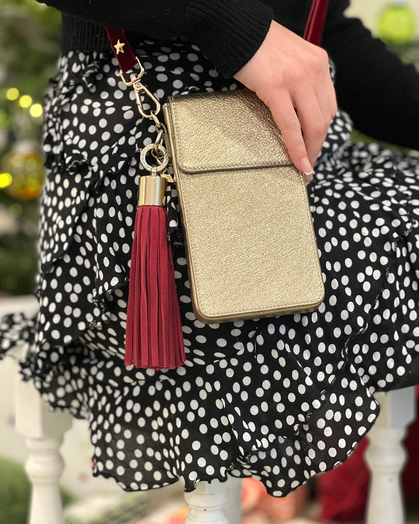 Gold Leather Phone Bag  with interchangeable red velvet skinny strap and removable raspberry red suede large bag tassel with gold hardware 