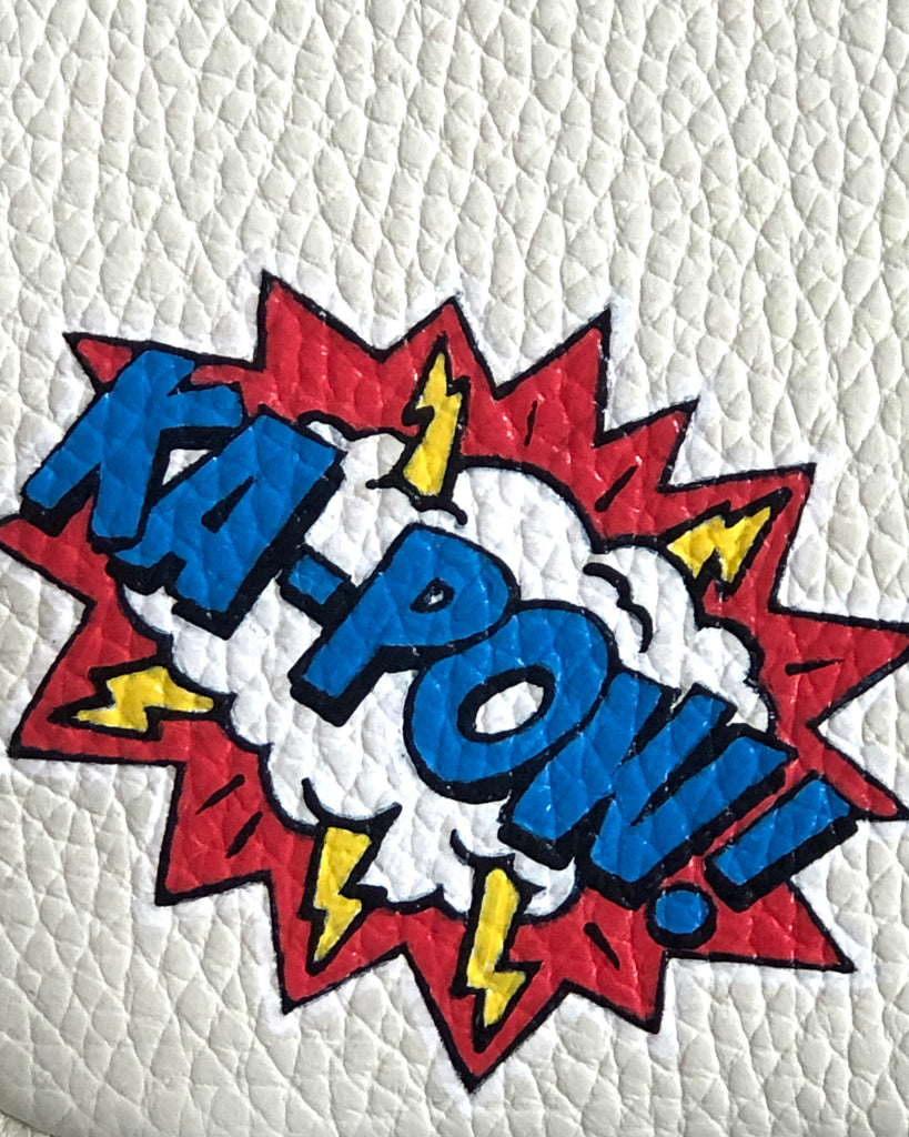 Kapok graphic painting which is on the white small leather bag 