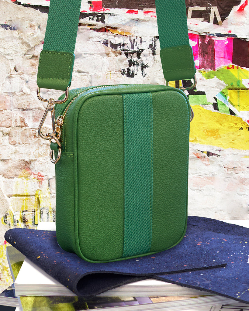 Green leather camera bag with gold hardware