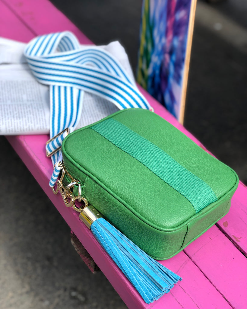 Green leather camera with interchangeable strap and tassel 