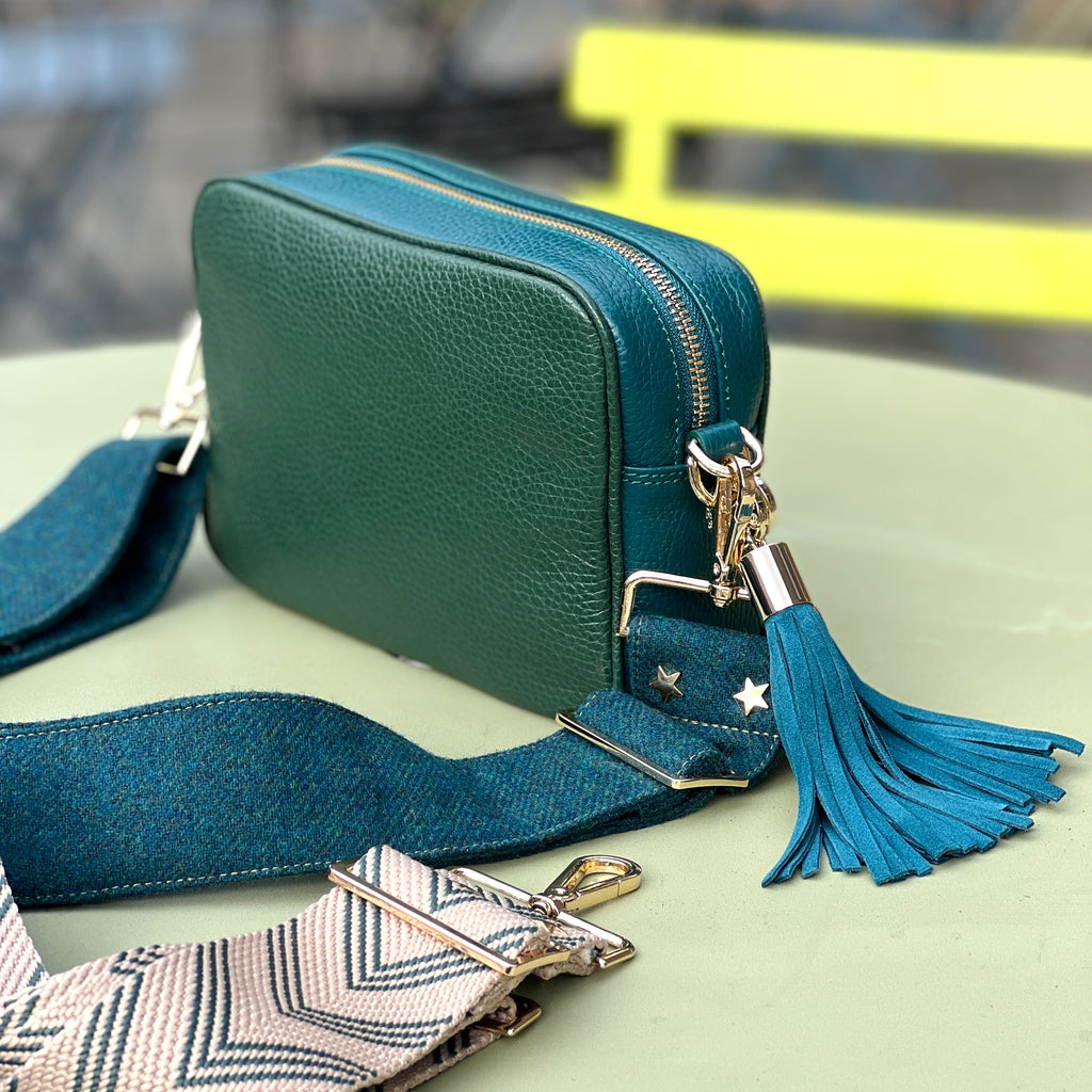 Green Two tone leather crossbody camera style bag with green fabric strap and teal suede tassel