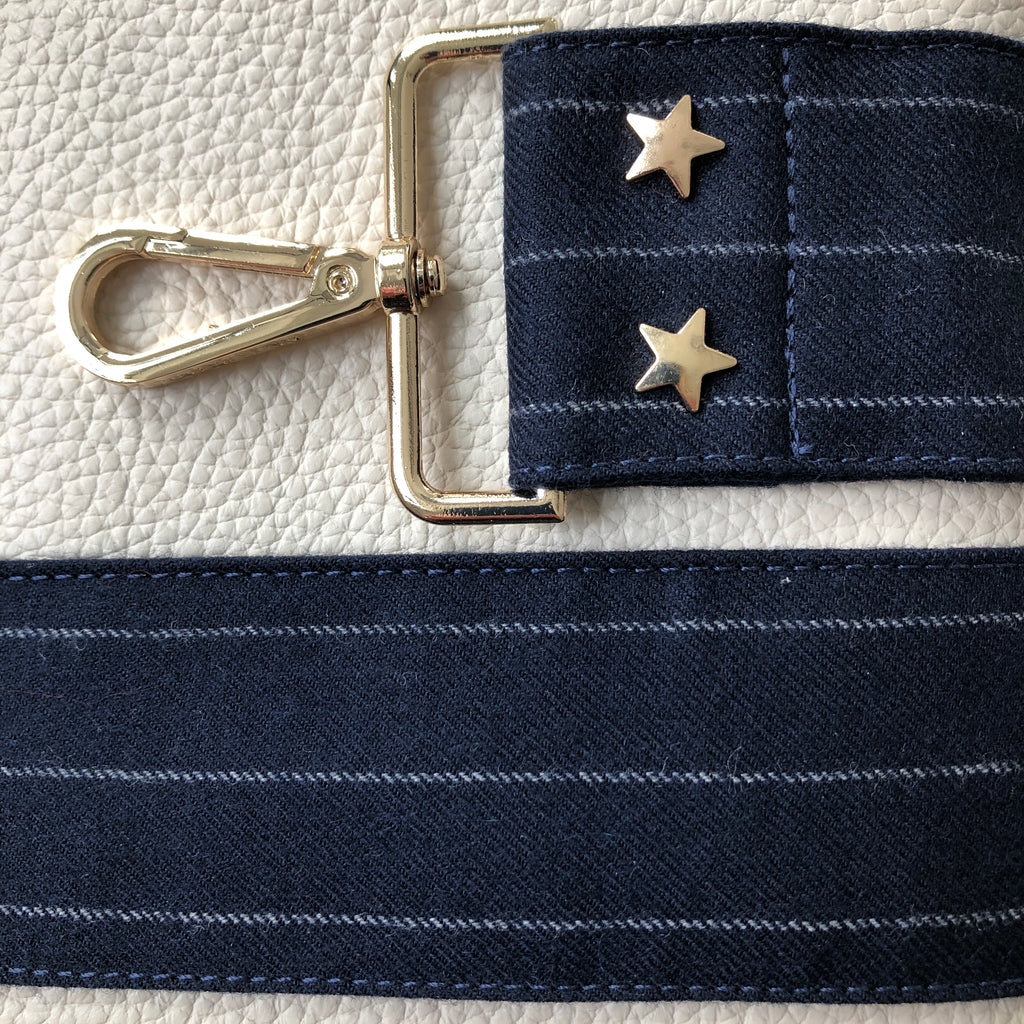 Interchangeable blue pin stripe wide fabric bag strap with gold hardware