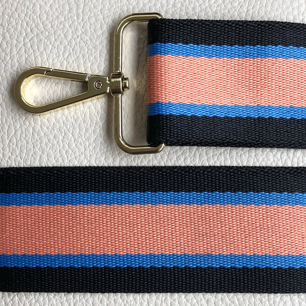 Interchangeable orange and black and blue wide fabric bag strap with gold hardware