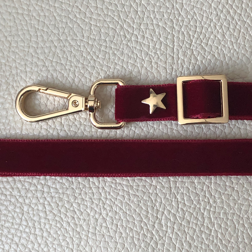 Interchangeable red skinny velvet bag strap with gold hardware