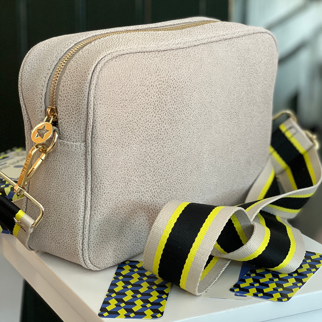Large leather cream textured crossbody bag with black yellow and beige striped fabric wide interchangeable strap