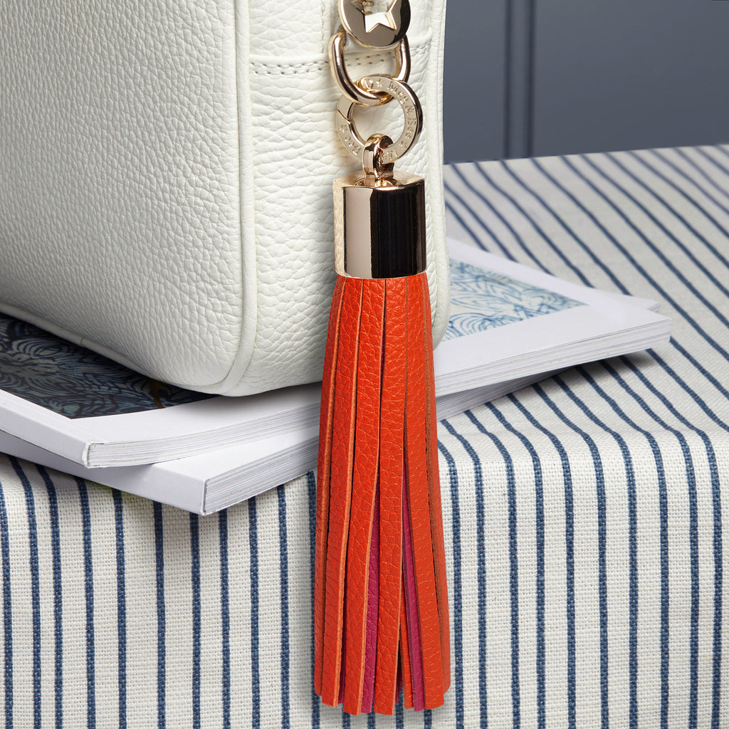 Large leather orange and pink removable bag tassel with gold hardware charm ring 