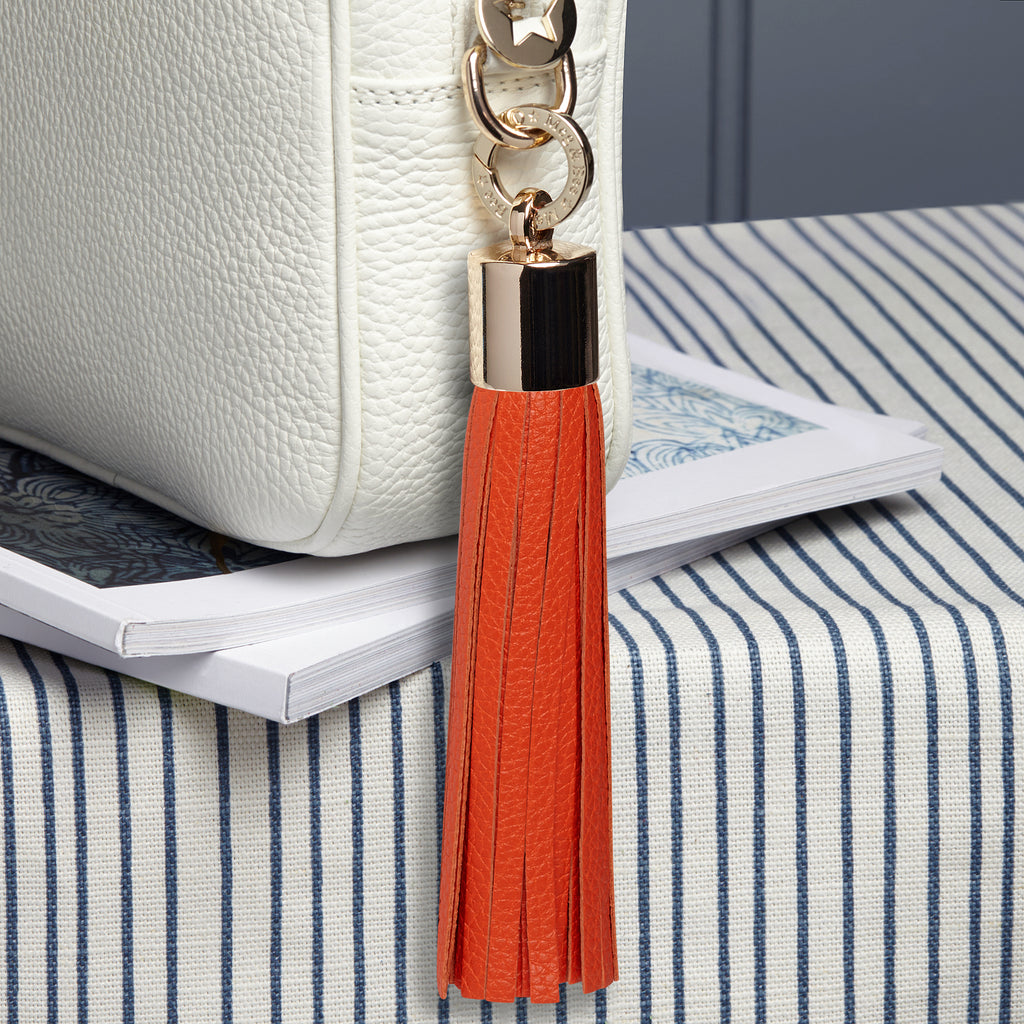 Large leather orange removable bag tassel with gold hardware attachable charm ring 