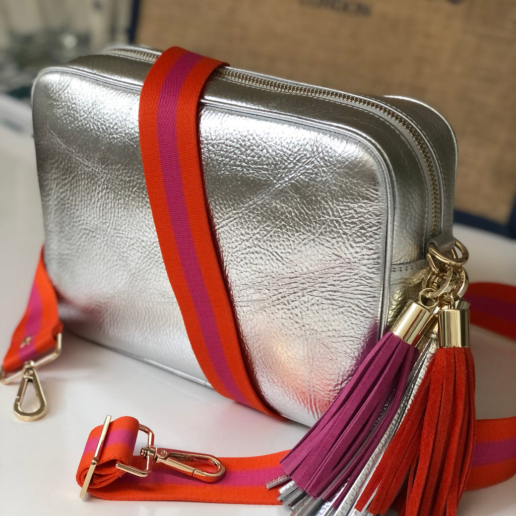 Large leather silver crossbody bag with slim interchangeable orange and pink strsp with orange suede tassel and pink suede tassel 