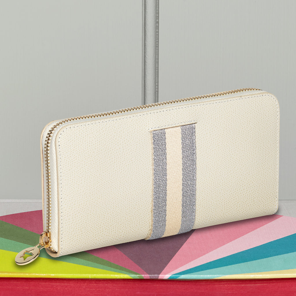 Large rectangular cream leather purse with silver and cream central webbing stripe with gold hardware