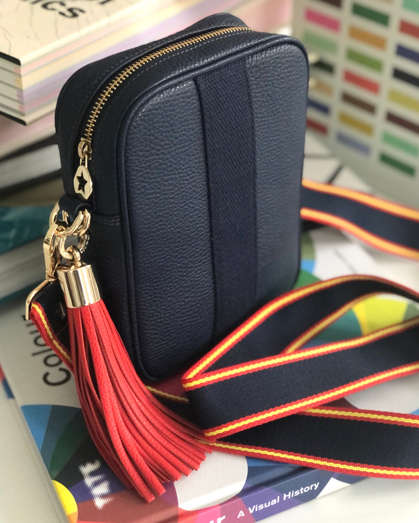 Navy blue camera. crossbody bag with interchangeable strap and tassel