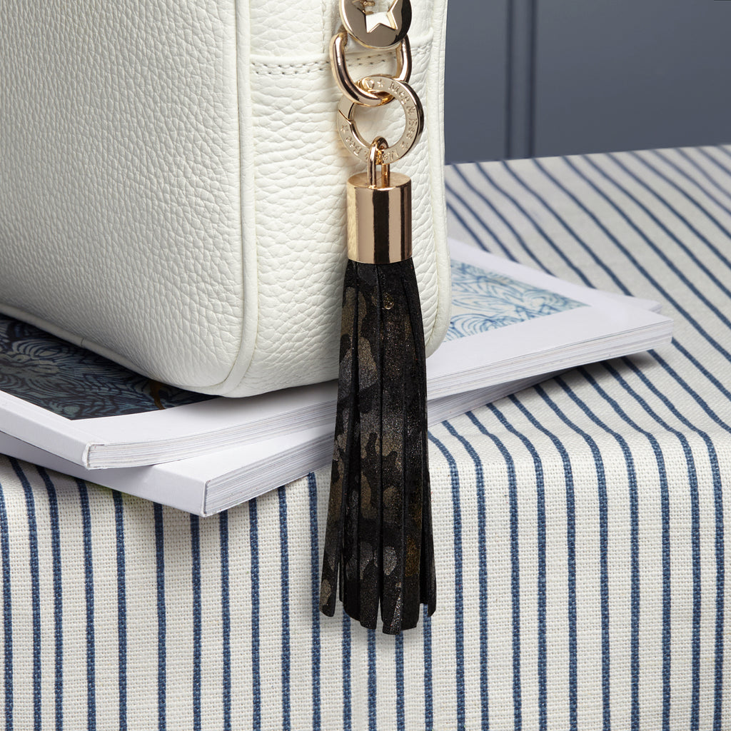 Small leather suede black camouflage patterned removable bag tassel with gold hardware attachable charm ring 