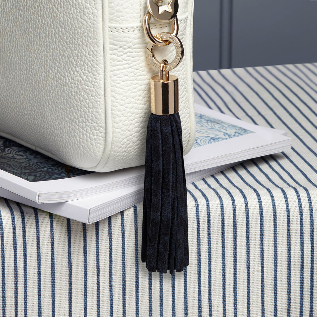 Small suede navy leopard print removable bag tassel with gold hardware and gold hardware attachable charm ring 