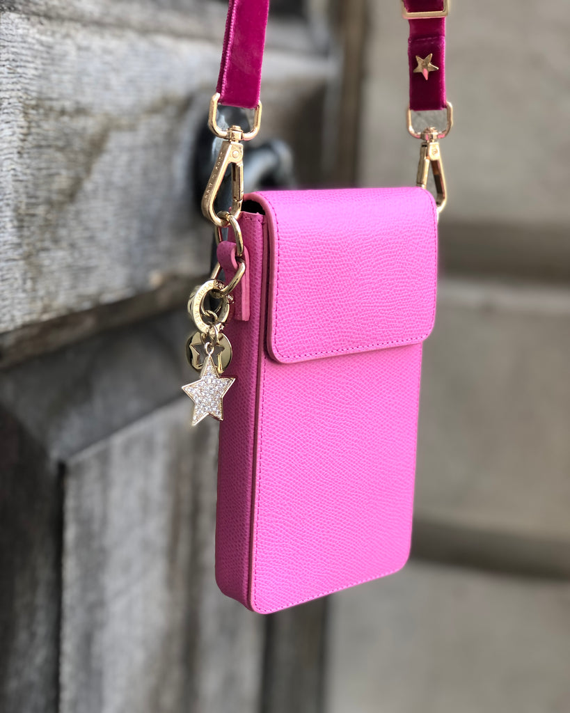 Small leather phone bag with pink interchangeable skinny strap 