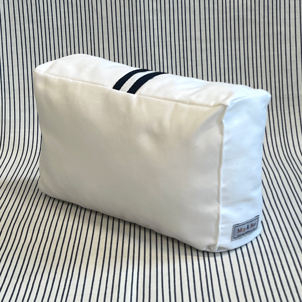 White bag pillow with navy/white carry handle