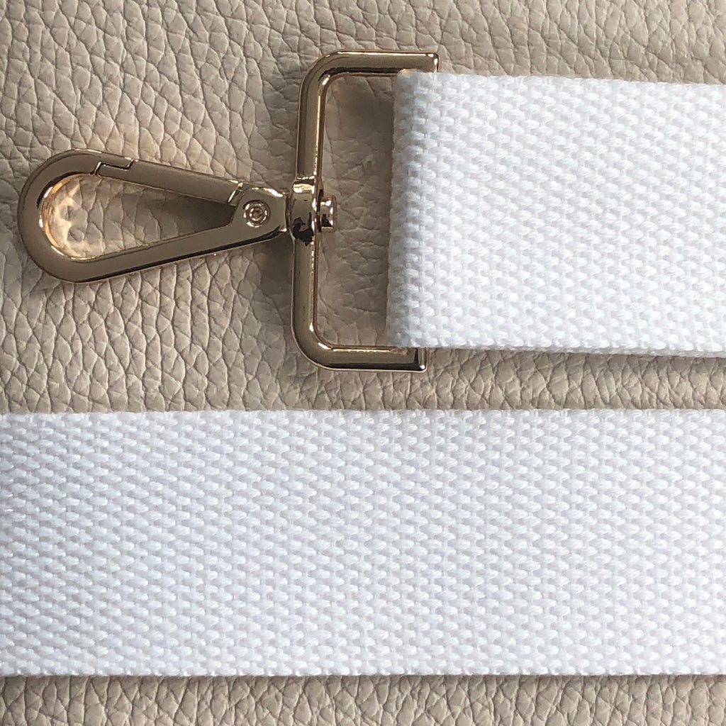 Interchangeable white fabric slim crossbody bag strap.