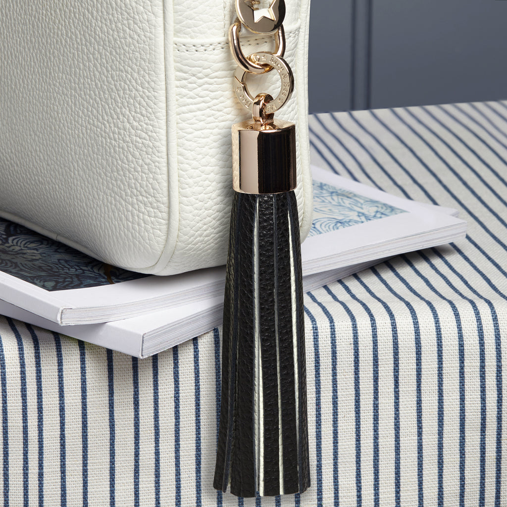 large leather black and white removable bag tassel with gold hardware attachable ring 