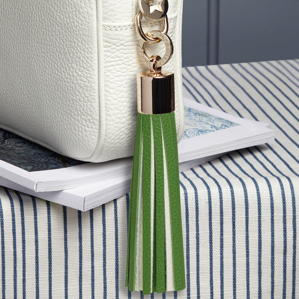 large leather green and white removable bag tassel with gold hardware and attachable charm ring 