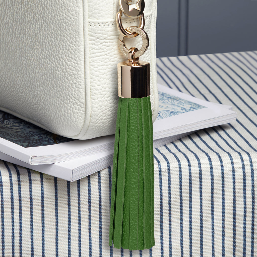 large leather green removable bag tassel with gold hardware and attachable charm ring 